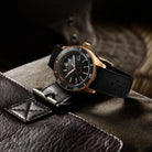 bronze watch black dial